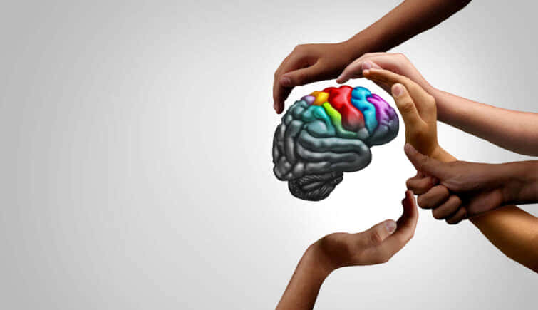 自閉症患者さんの脳と支援の手のイメージ画像